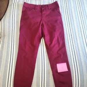 Deep red skinny jeans